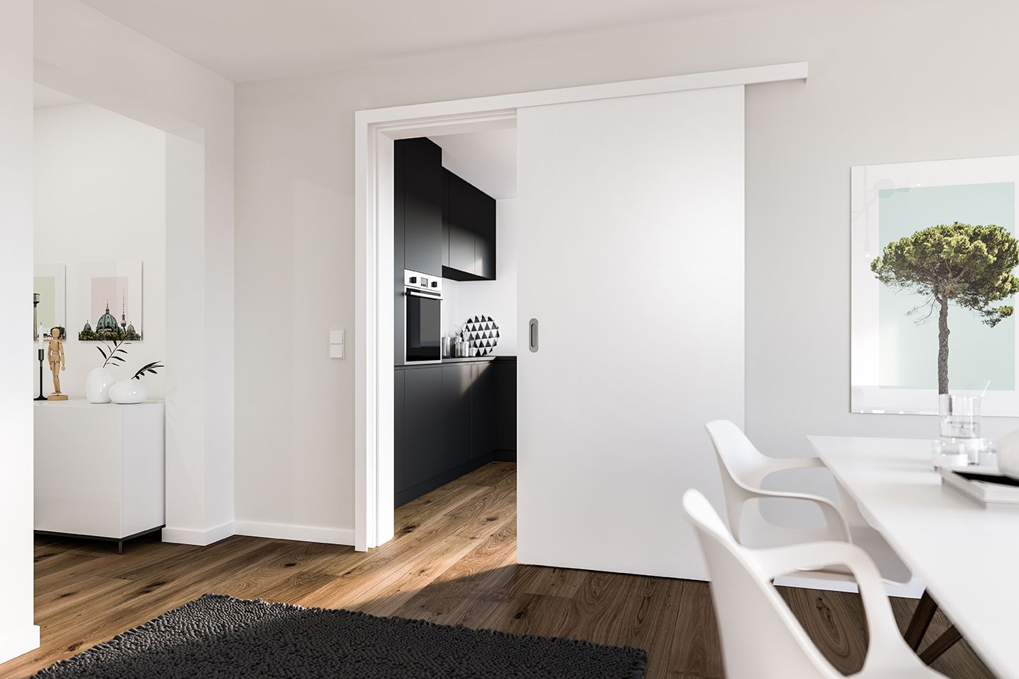 Une porte coulissante blanche ouvre sur une cuisine moderne, avec un sol en bois et des meubles épurés.