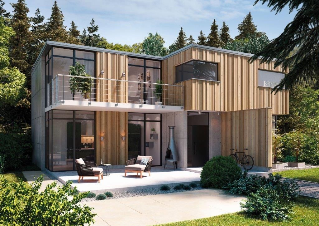 Maison moderne en bois et béton, entourée de verdure, avec un balcon et des chaises.
